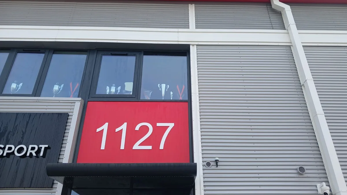 Commercial unit metal cladding after cleaning - restored to clean finish