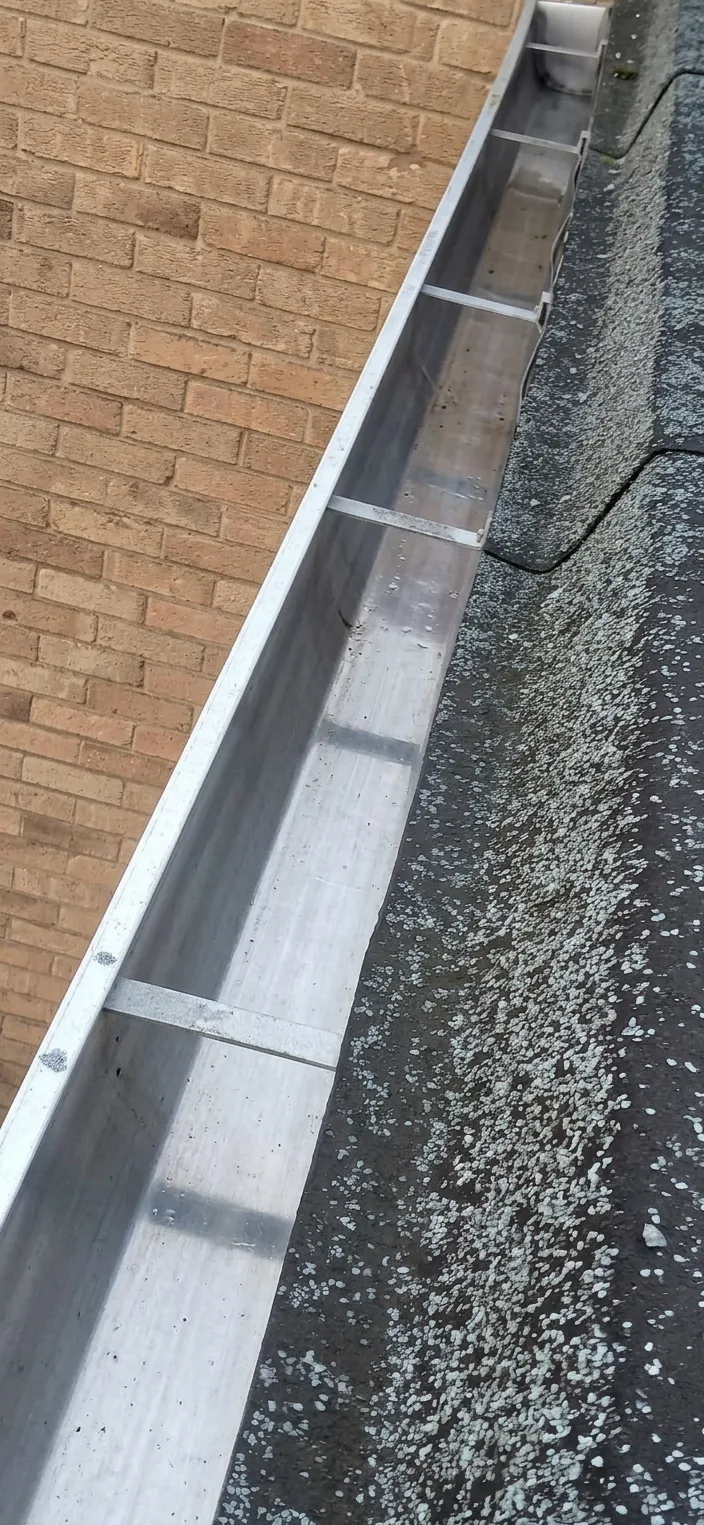 Gutter after cleaning - clear and flowing