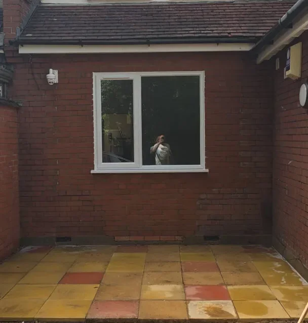 Buff and red flagstone patio at a Luton property after jet and steam cleaning