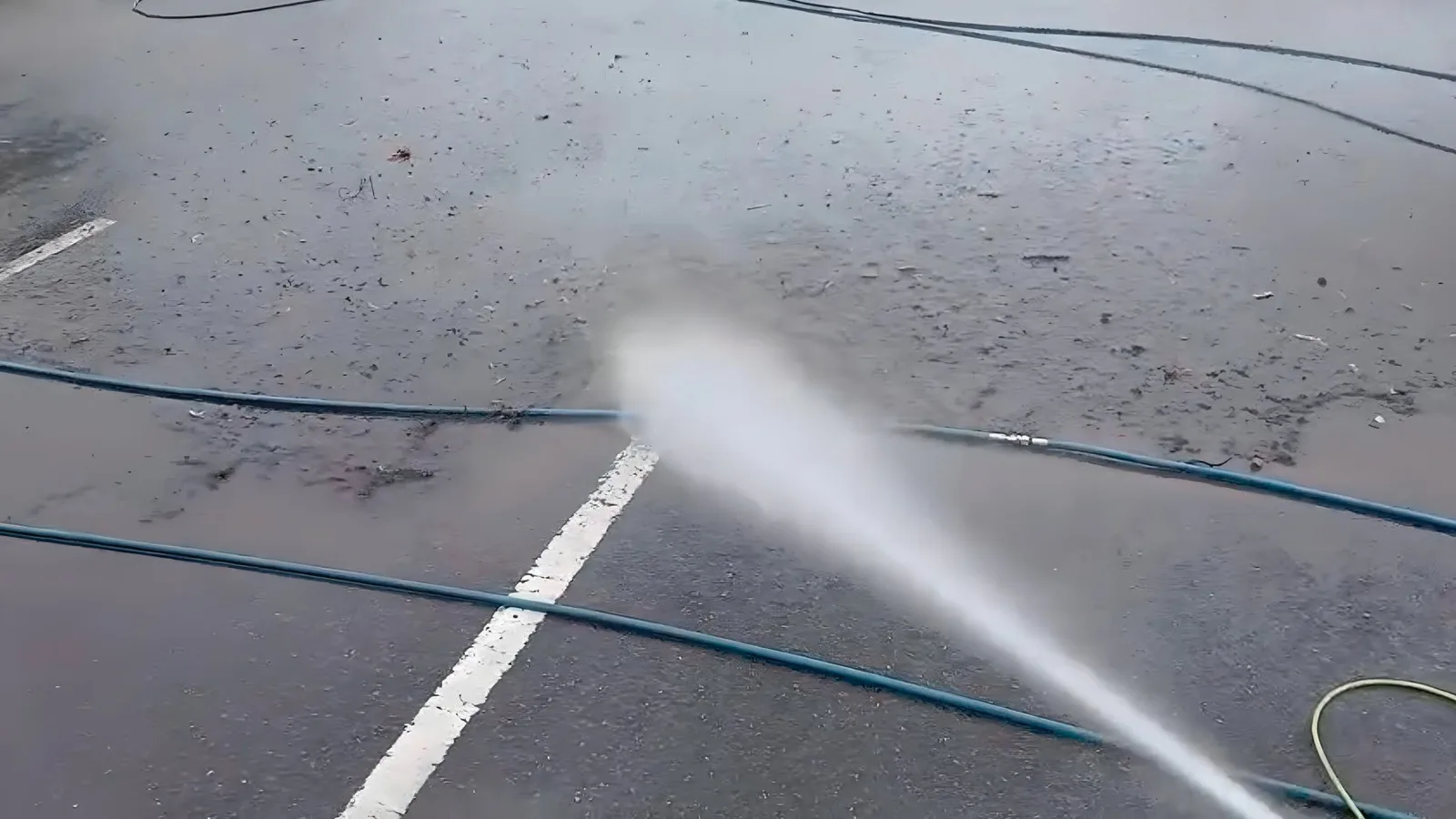 Commercial tarmac pressure washing with industrial equipment