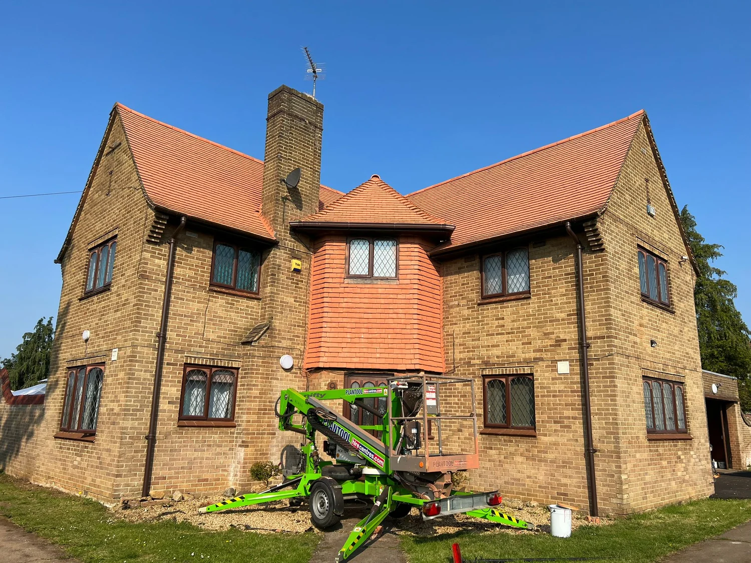 Clay tile roof cleaning and painting with cherry picker access in Northampton