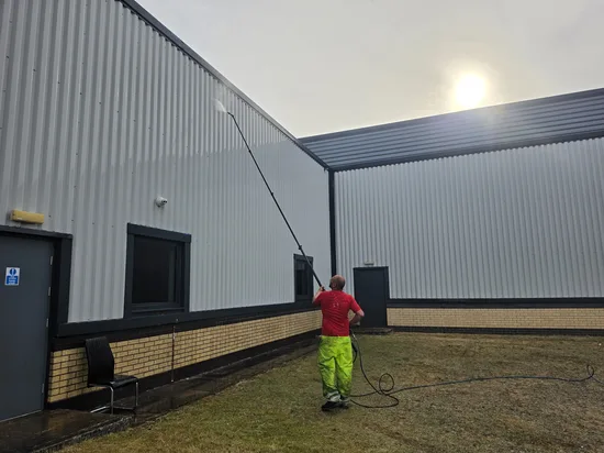 commercial building metal cladding water fed pole wash