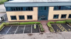 During - commercial building water fed pole window fascia clean, Rugby.