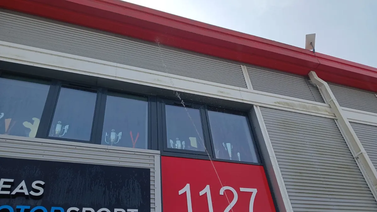 Commercial metal cladding during cleaning - 2 Seas Motorsport Unit 1127, Silverstone Business Park, Towcester