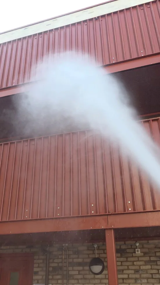 During - residential two storey red metal cladding pressure washed overspray, Cambridge.