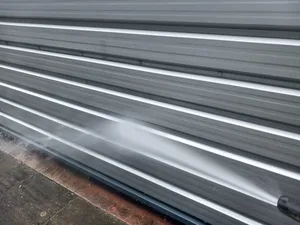 During - commercial industrial unit profiled metal cladding steam cleaned lower panels, Dunstable.