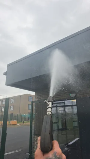 commercial school glazed facade water fed pole window cleaning
