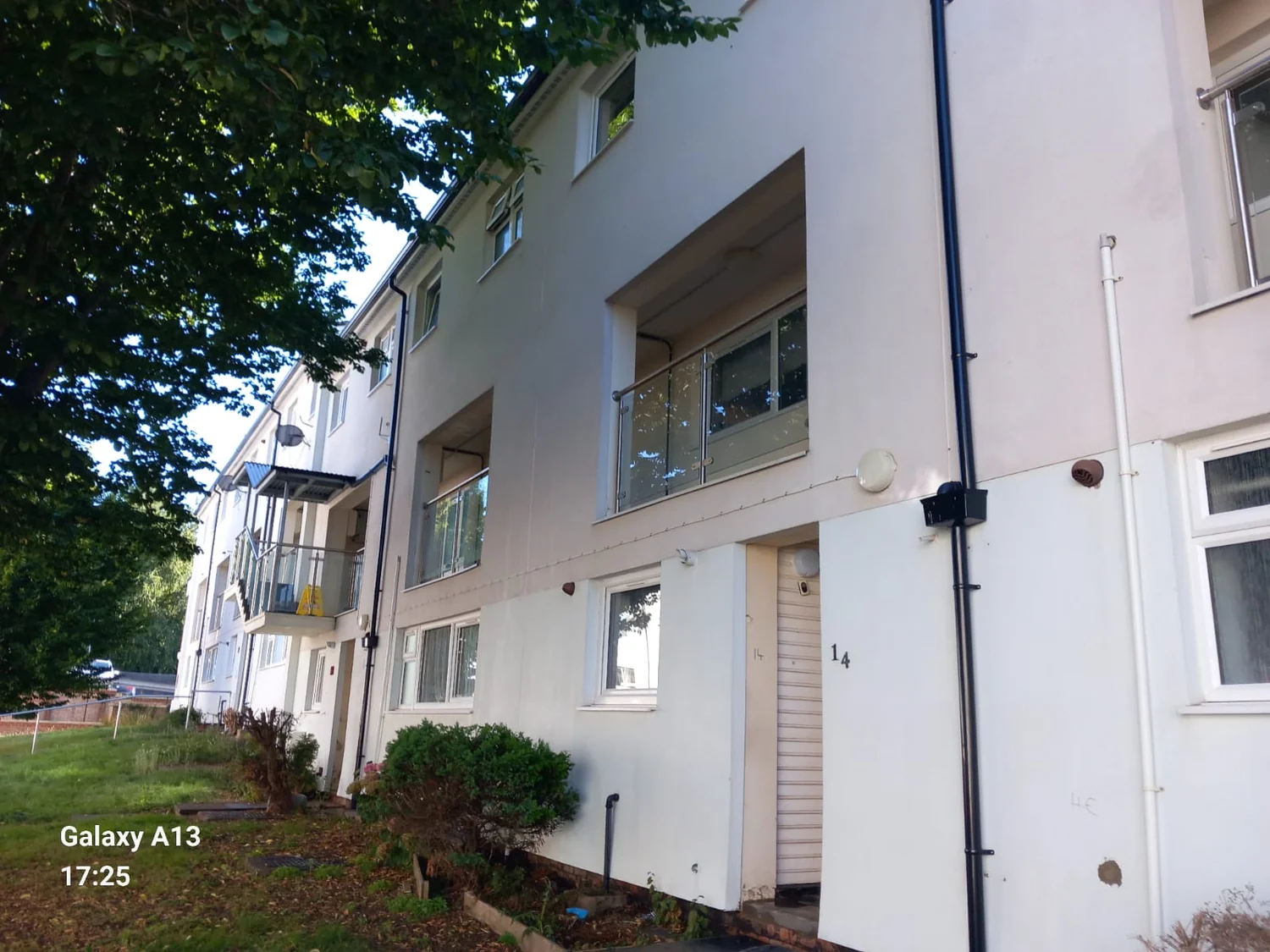 Council housing block after render and cladding cleaning - Northampton City Council programme