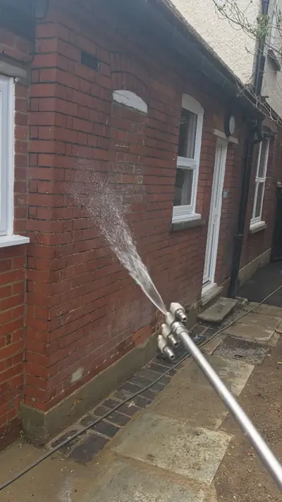 Softwash solution being applied to the brickwork during cleaning - Luton