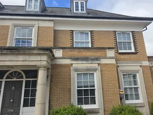Before - large residential buff brick facade weathering stone surround staining, Orlingbury.