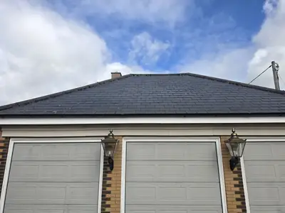 Garage slate roof with light algae before cleaning - Orlingbury