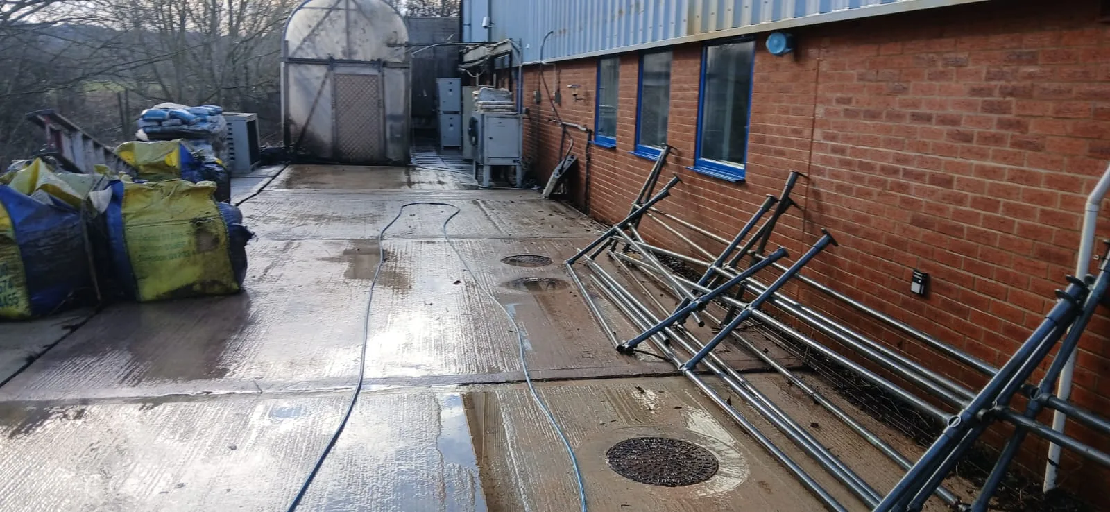 Warehouse hardstanding and cladding after pressure washing at Lung Wah Chong, Oxford