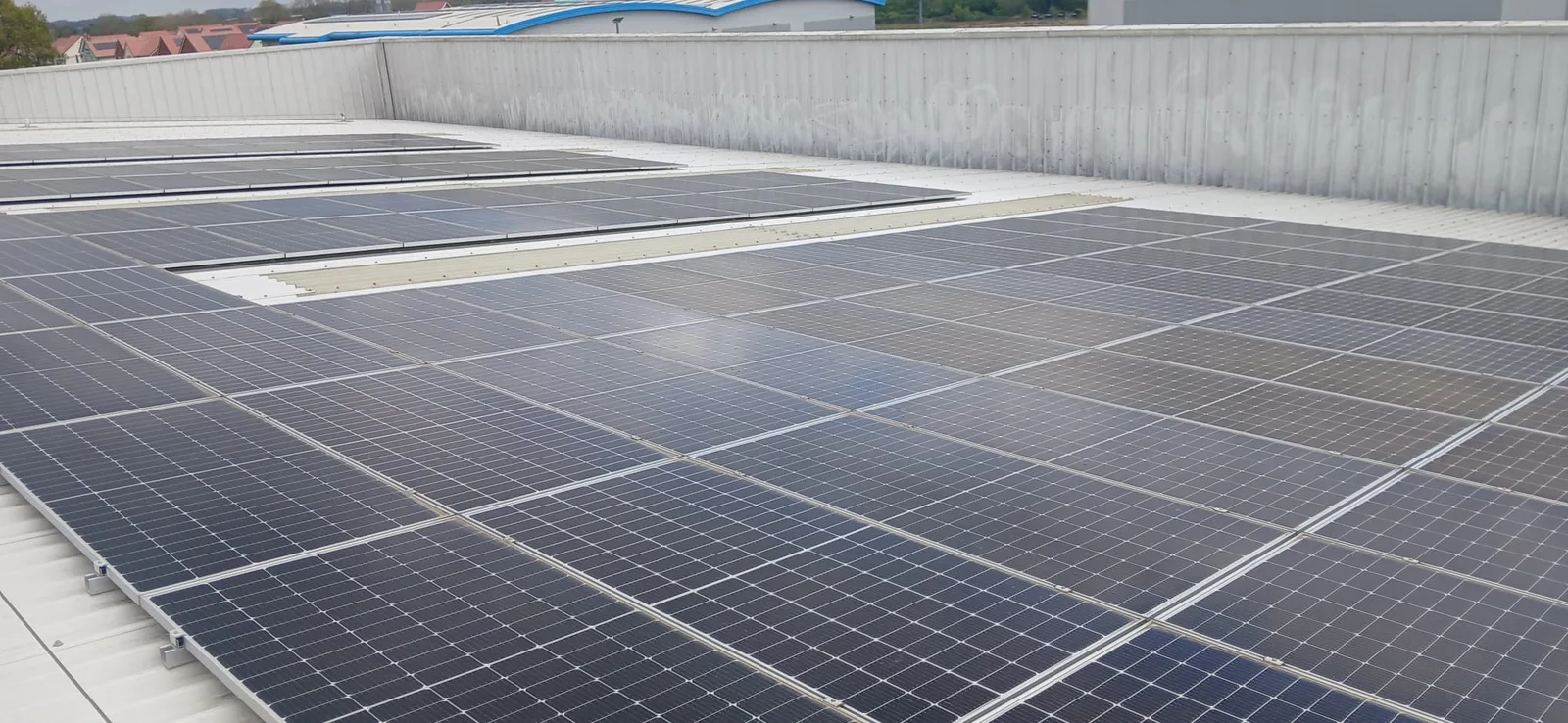 Large solar panel array after pure water cleaning - Partridges warehouse, Desborough