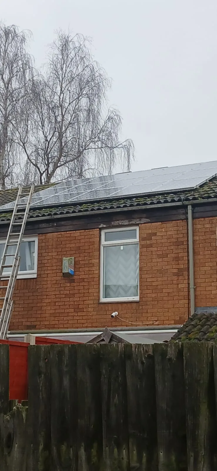 Residential solar panels on roof - cleaning access with ladder