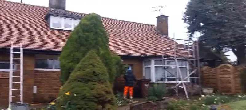 Exterior Cleaning Solutions team accessing residential solar panels for cleaning using scaffold tower
