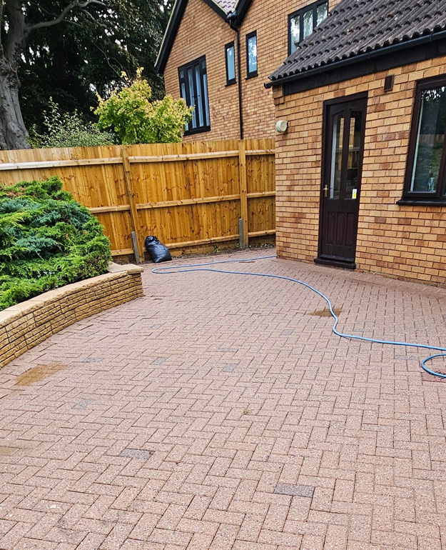 freshly power washed patio wall and fence